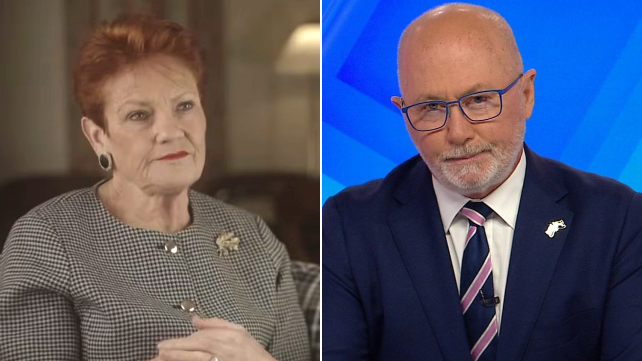 Split-screen: left an elderly woman with short red hair in a checkered blouse; right a bald man with glasses in a navy suit and striped tie in a TV studio.