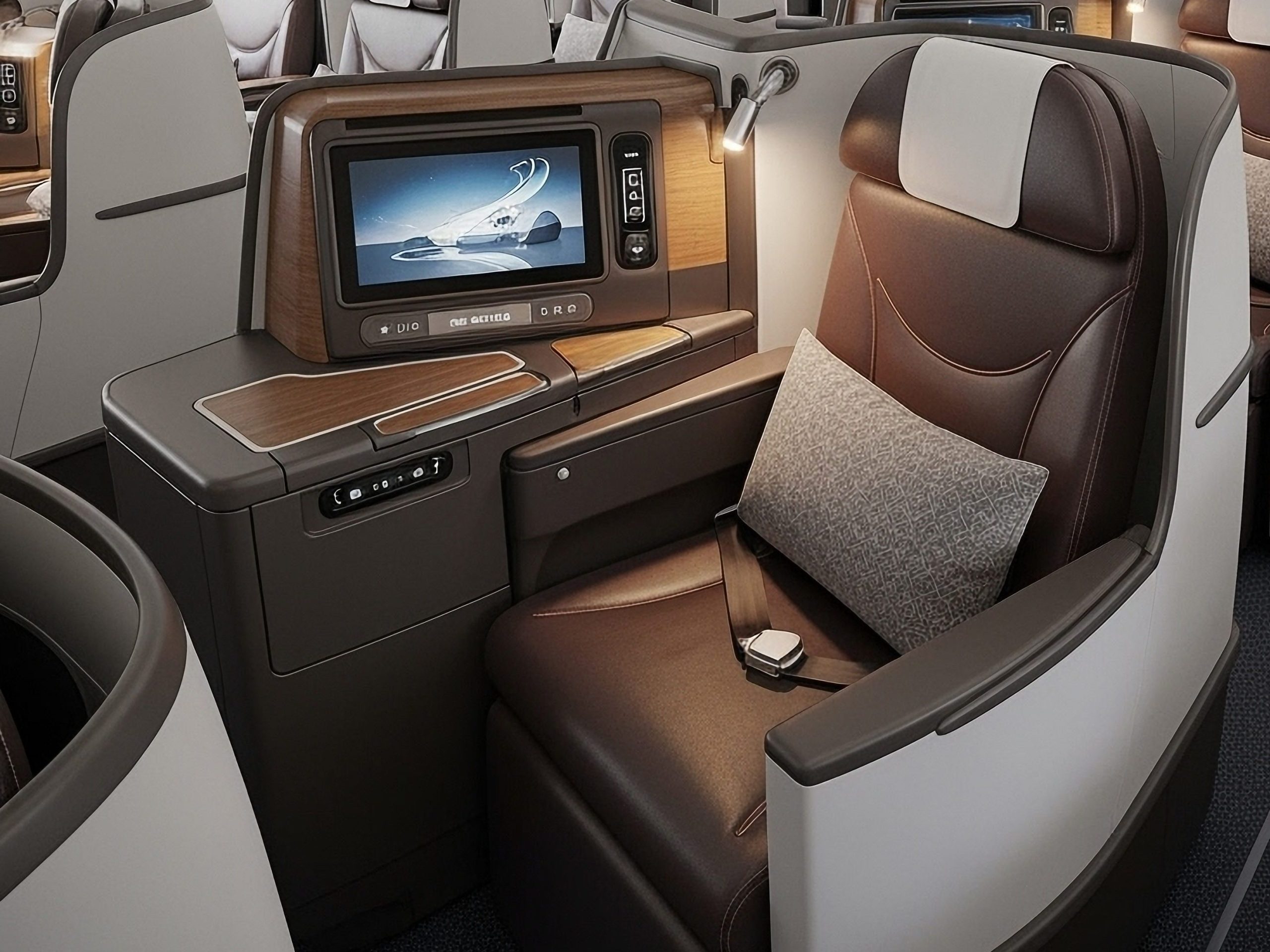 Business-class airplane cabin with lie-flat seats, individual screens, and wood-trimmed panels along the row of privacy pods.