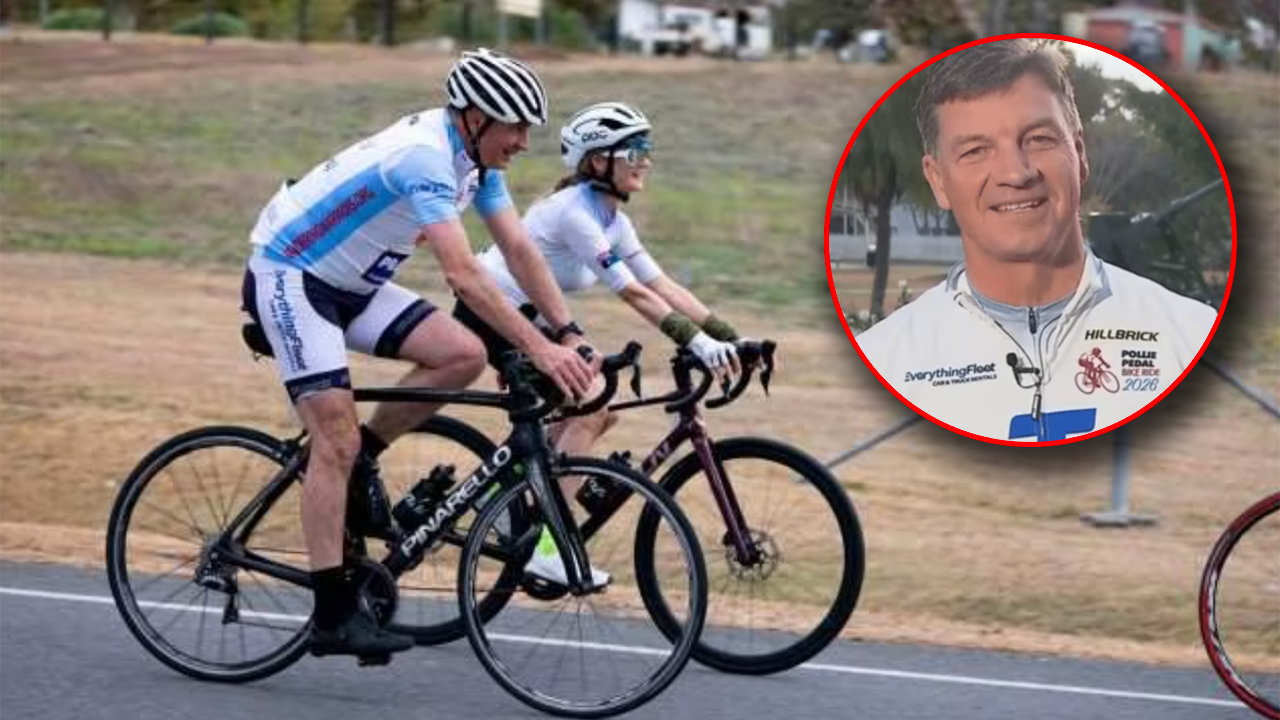 Two cyclists ride road bikes in a race on a paved path; an inset circle shows a smiling man in a white cycling jersey with logos nearby.